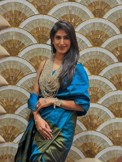 Here I am in another one of my favorite sarees. The rich color and beautiful drape of this piece make me feel confident and graceful, embodying the timeless elegance I teach my clients.