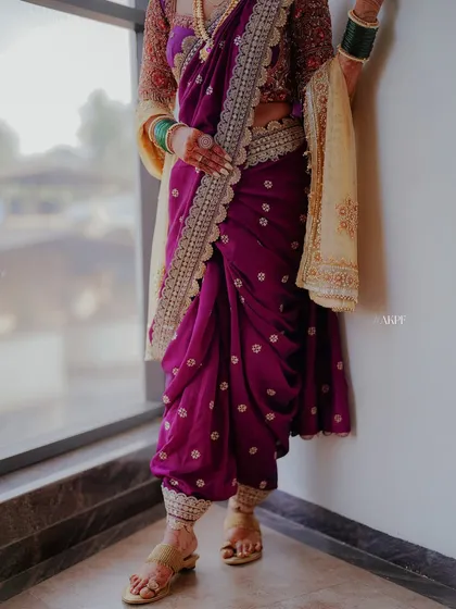 The elegance of a traditional Nauvari saree is unmatched. I specialize in pre-pleating and draping this iconic Maharashtrian attire, ensuring a perfect, comfortable fit for the main wedding ceremony.