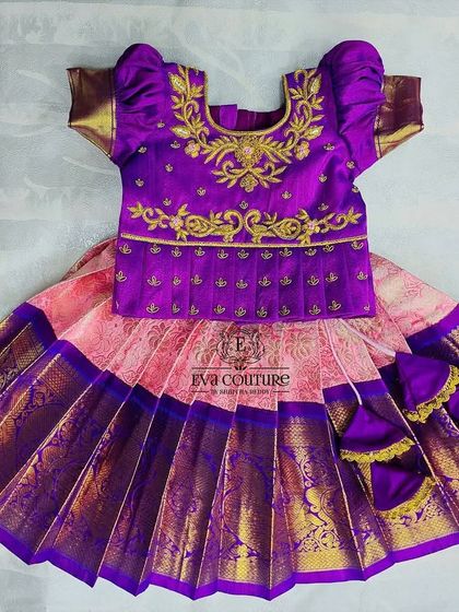 A closer look at the newborn Pattu Pavadai from the brother-sister twinning set. It features a beautifully embroidered blouse.