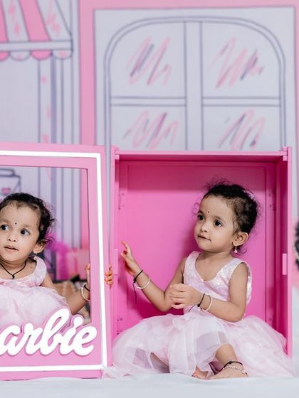 Come on Barbie, let's go party! This incredibly fun and creative Barbie-themed photoshoot for twin girls is one of our favorite setups.
