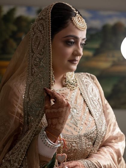 A serene, classic portrait of the bride. The makeup is soft and blended to perfection, creating a dreamy and ethereal vibe.