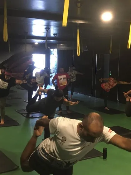 The energy of a group class is truly special. Here, students are practicing Natarajasana, the Lord of the Dance Pose, at my Basavanagudi studio. We focus on building balance and concentration together, creating a supportive environment where everyone can challenge themselves.