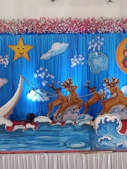For a unique baby shower, I designed this whimsical night-sky theme. It features a crescent moon boat, stars, clouds, and even reindeer props for a magical feel.