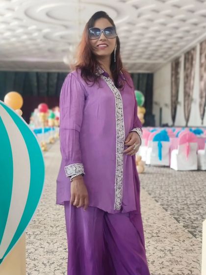 A stylish pose at the baby shower venue. The pastel and hot-air balloon decor created such a dreamy atmosphere for the celebration.