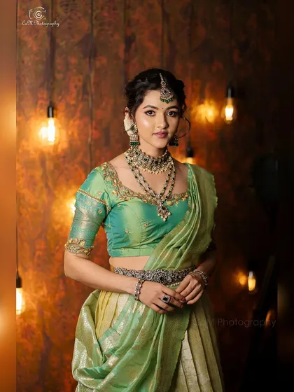 This is an example of my full-service ethnic styling for actress Samiksha. I coordinated this beautiful mint and gold lehenga with intricate traditional jewelry, complemented by flawless makeup and hair for a regal portrait.