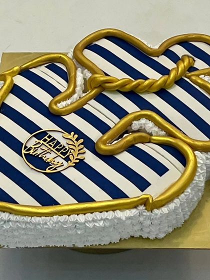 A different angle of the anchor-shaped cake. The clean lines and bold colors make it a really striking design for a birthday celebration.