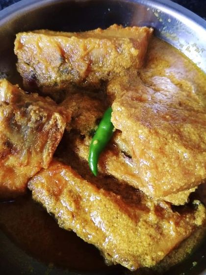 Doi Maach, another version of fish in a yogurt gravy. This preparation is slightly different from Doi Katla, offering a unique taste profile that is equally delicious and perfect for special occasions.