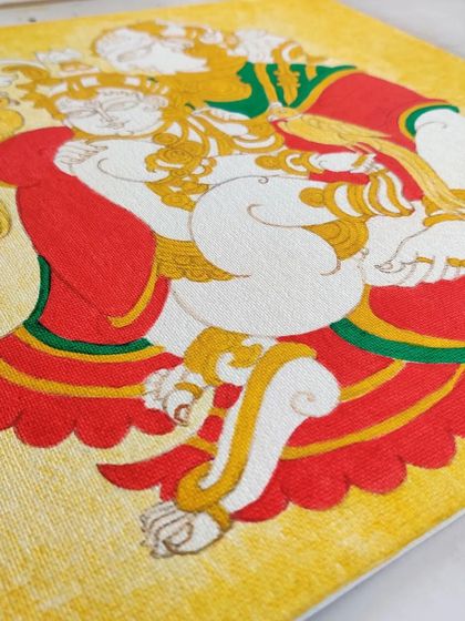 The Yashodakrishna painting with base colors applied. The red and yellow create a warm and loving atmosphere.