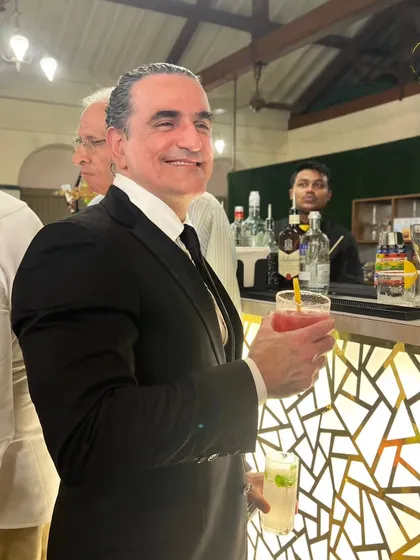 A happy guest enjoying a refreshing cocktail at one of our events. Our goal is always to serve smiles with every sip.