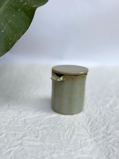 The Party Ashtray with its lid on. It's a sleek, contained design.