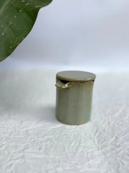 The Party Ashtray with its lid on. It's a sleek, contained design.