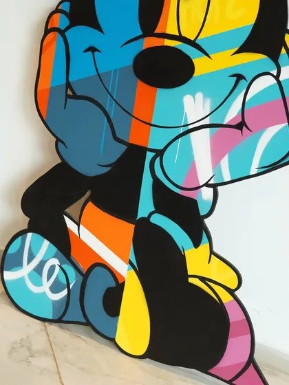 Another angle on the Minnie Mouse artwork, showing how the different colored sections and patterns interact across the layered wood surface.