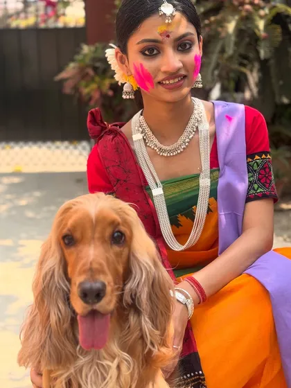 Posto making friends with the beautifully dressed dancers during the Basanta Utsav (Spring Festival) in Santiniketan.
