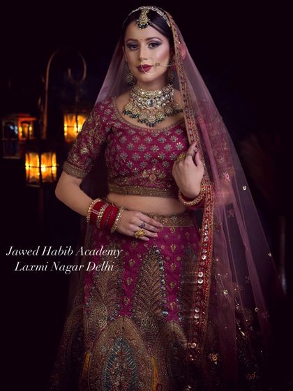 This portrait showcases a regal bridal look with a focus on classic makeup and a sheer veil. Our students learn to create looks that are both traditional and elegant.