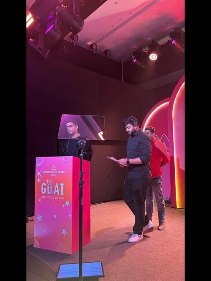 Our team rehearsing with the host at the teleprompter for the Myntra G.O.A.T. Awards.