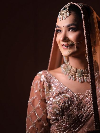 A beautifully lit portrait that highlights the soft glam makeup. The focus is on radiant skin and eyes that sparkle, perfect for a romantic evening.