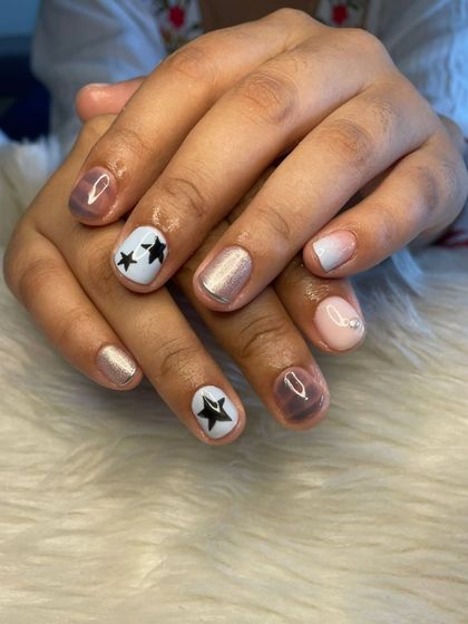 A fun gel polish set with a mix of different designs, including star art, shimmer, and ombré.