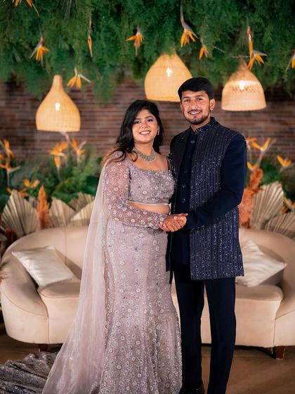 A candid moment of laughter between Yeshaswini and Shashank. We designed a boho-chic backdrop with cane lanterns and birds of paradise that perfectly matched their relaxed and happy vibe.