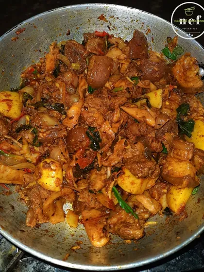 A pan full of my spicy pork with bamboo shoots stir-fry, a dry and intensely flavorful dish.