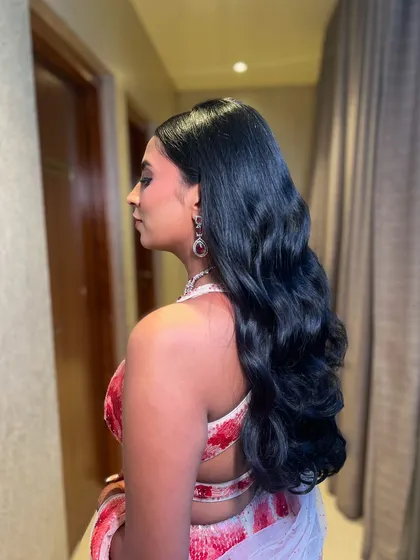The final look, a stunning and glamorous hairstyle that is sure to turn heads.
