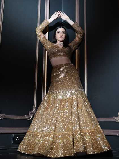 A high-fashion pose showcasing the full outfit and the dramatic makeup. This is where artistry and fashion meet.