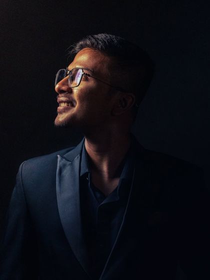 Another take on my artistic portrait. The light represents belief, and my smile reflects the joy I find in my craft.