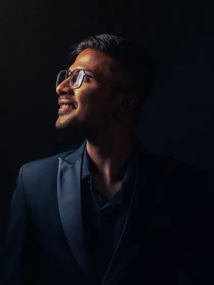 Another take on my artistic portrait. The light represents belief, and my smile reflects the joy I find in my craft.