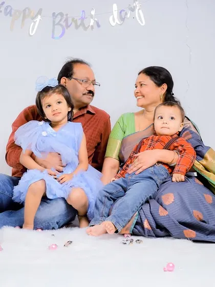 A candid moment between grandparents and grandchildren during a studio session. These natural interactions make for the most cherished photographs.