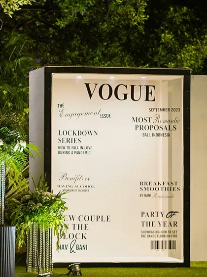 I love adding modern, personalized touches to any event. This custom life-sized 'Vogue' magazine cover photo booth was a huge hit at an engagement party, allowing the couple and their guests to become the stars of their own love story.