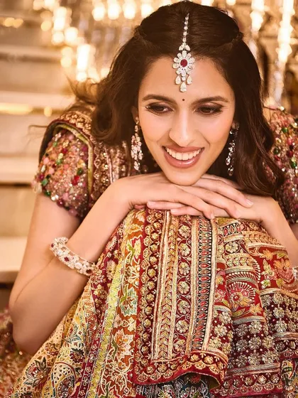 A joyful moment captured in a stunning Tarun Tahiliani lehenga. The intricate work and beautiful colors are perfect for festive celebrations like a garba night.