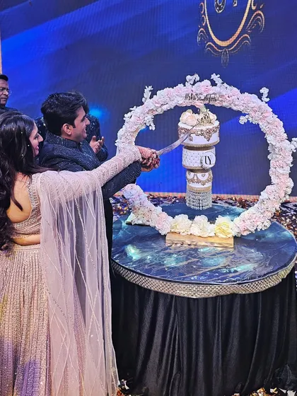 A beautiful moment of the couple cutting their chandelier engagement cake. I love seeing my creations become part of such happy memories.