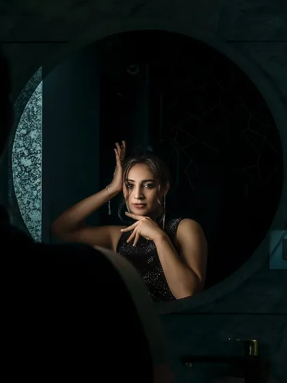 Creative angles and compositions are key to my editorial work. This mirror shot creates a sense of intimacy and drama, drawing the viewer in. It’s a technique I use to add an artistic layer to a fashion shoot, making the images more compelling and memorable.