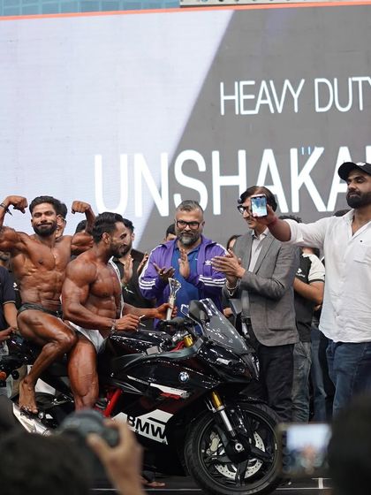 Sharing the victory with my fellow competitors. Bodybuilding is about respect and brotherhood, even when you are competing for the top spot.