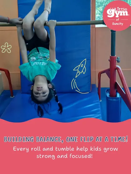 Building balance, one flip at a time. Hanging upside down on the bar is a fun way to get comfortable with inversions while strengthening arm and core muscles.