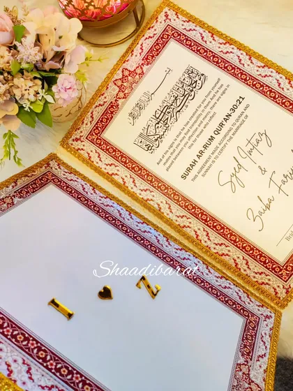 The inside of a personalized Nikah booklet. One side holds the official contract, while the other features the couple's initials for a personal touch.