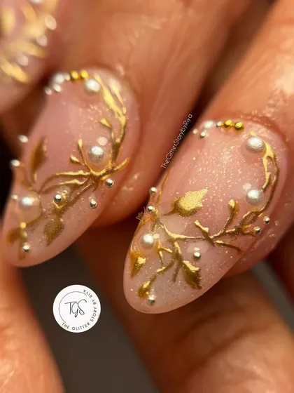 Another angle showing the intricate detail of the 3D gold and pearl nail art. You can see how the elements are layered to create depth and texture, perfect for wedding photography.