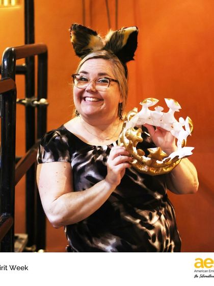 A teacher proudly displays her animal ears and a paper crown during MS Spirit Week. It's these moments of shared fun and creativity that strengthen the bonds within our school community.