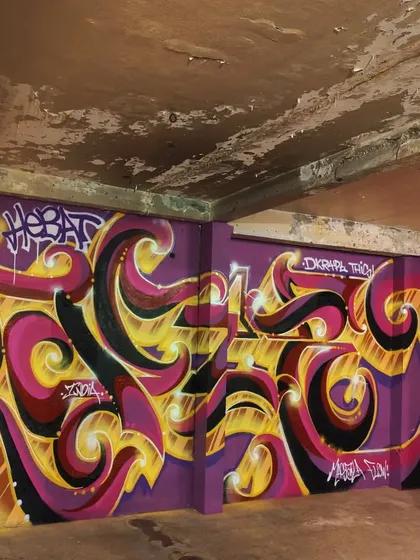 This is my Masala Flow. I mix classic graffiti with Indian flavor, using Hindi letters to create something new. This piece, done in Malaysia, shows how I bring my roots to walls across the world.