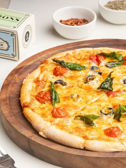 A classic Margherita pizza, perfectly baked with a crispy crust and beautifully melted cheese.