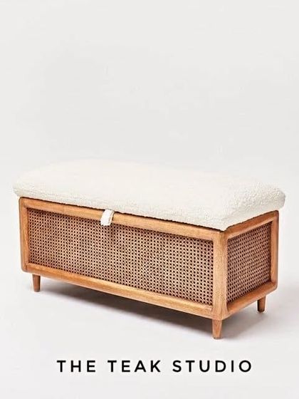 This versatile storage bench is perfect for the foot of a bed. It combines a light wood frame with cane panels and a comfortable bouclé fabric top that lifts to reveal storage space.