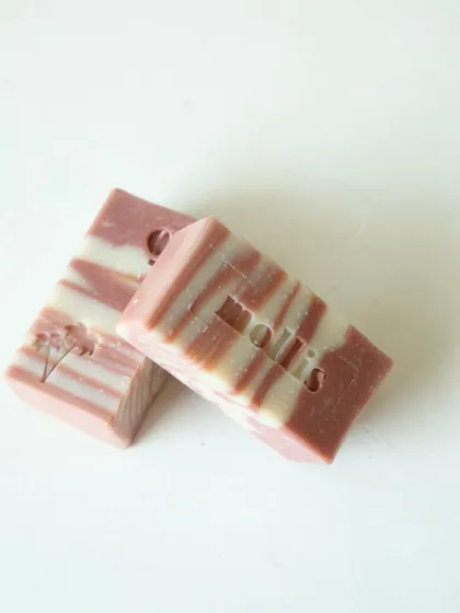 Two bars from the new batch, one stamped with a hot air balloon and the other with my logo.