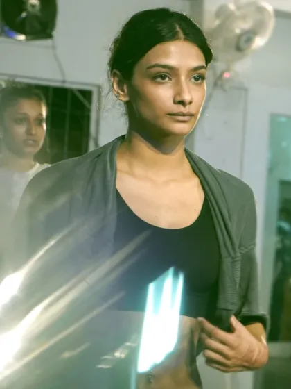 A moment of focused intensity. A dancer absorbs the choreography during the fire-packed Trinity weekend.