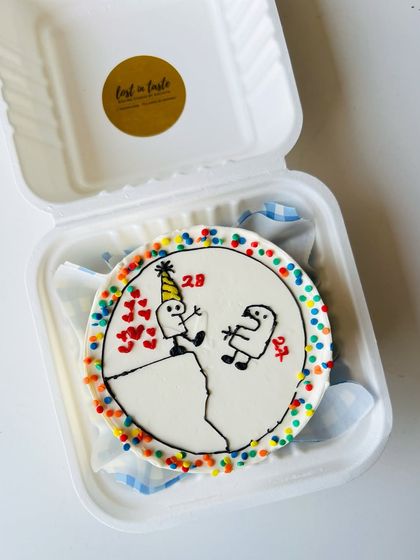 A custom birthday bento with a funny stick-figure scene. This design captures an inside joke between friends, complete with ages and a party hat.