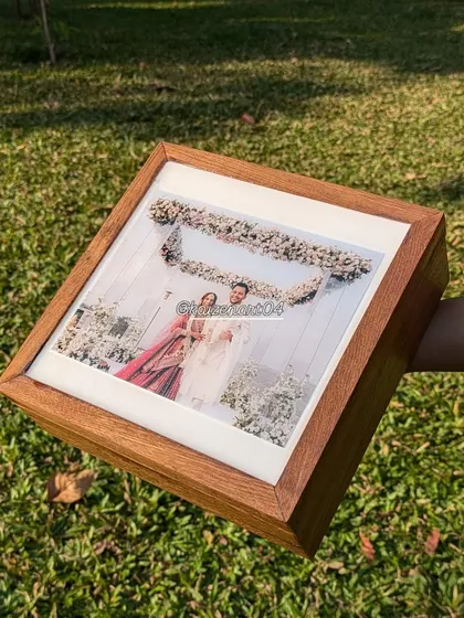 A side view of the 8x8 inch teak wood box frame, showing its depth and sturdy construction. The matte finish on the wood contrasts beautifully with the glossy resin.