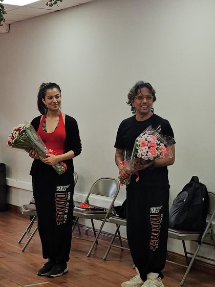 Our instructors holding bouquets after conducting the workshop at the American Embassy School.