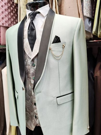 A collection of our designer suits, showcasing a variety of colors, fabrics, and custom details like embroidery, unique lapels, and accessories. Each piece is crafted to make a lasting impression.