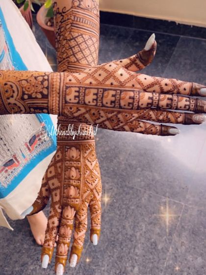 The back of the hands for an engagement design, featuring a band of elephants and beautiful check patterns.