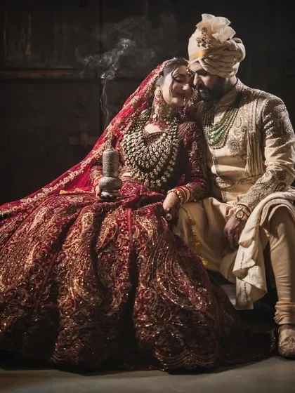 I believe in creating moments that feel like a scene from a classic film. This dramatic, moody shot captures the deep connection between the couple, with their coordinated regal attire telling a story of timeless love and opulence.