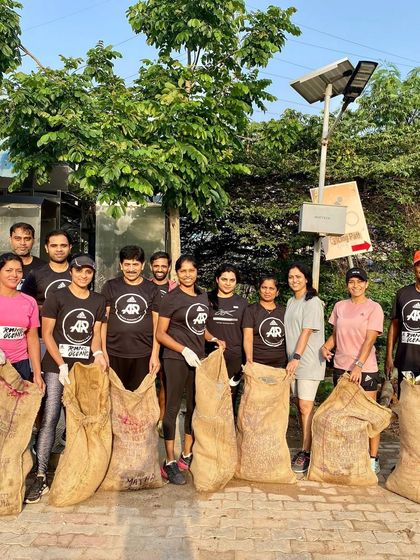 Our crew participating in a plogging run for the "Move For The Planet" initiative. We believe in giving back to the community and keeping our running routes clean.