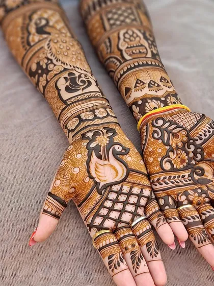 An elegant bridal design featuring swans, paisleys, and lotus motifs. The fine detailing and balanced composition make this a perfect choice for a bride who loves traditional art.